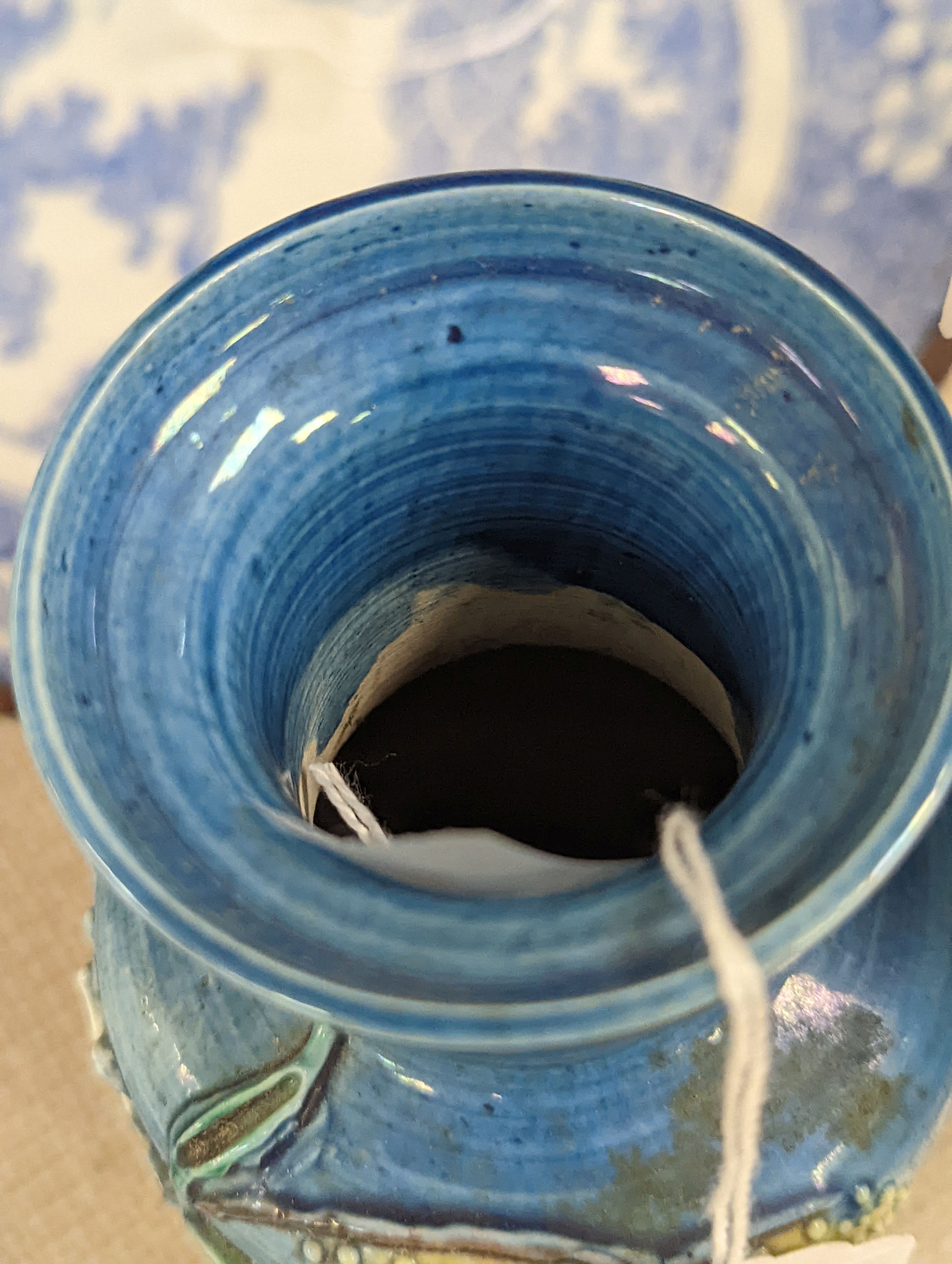 An early 20th century Chinese blue and white lidded vase together with a similar enamelled pottery vase and a Japanese blue and white dish. Tallest vase 29cm